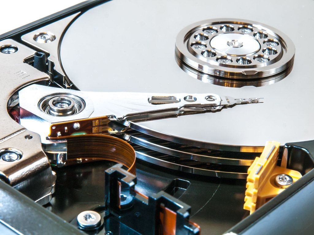 Open hard disk drive showing internal storage platters