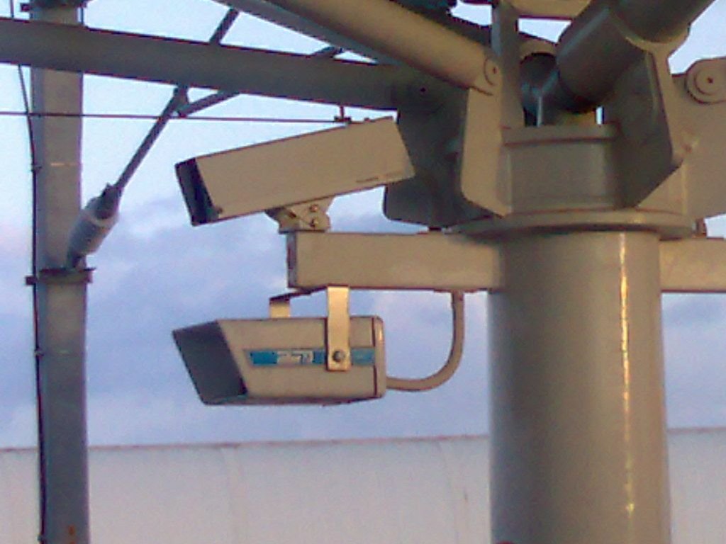 CCTV surveillance camera monitoring a street at night